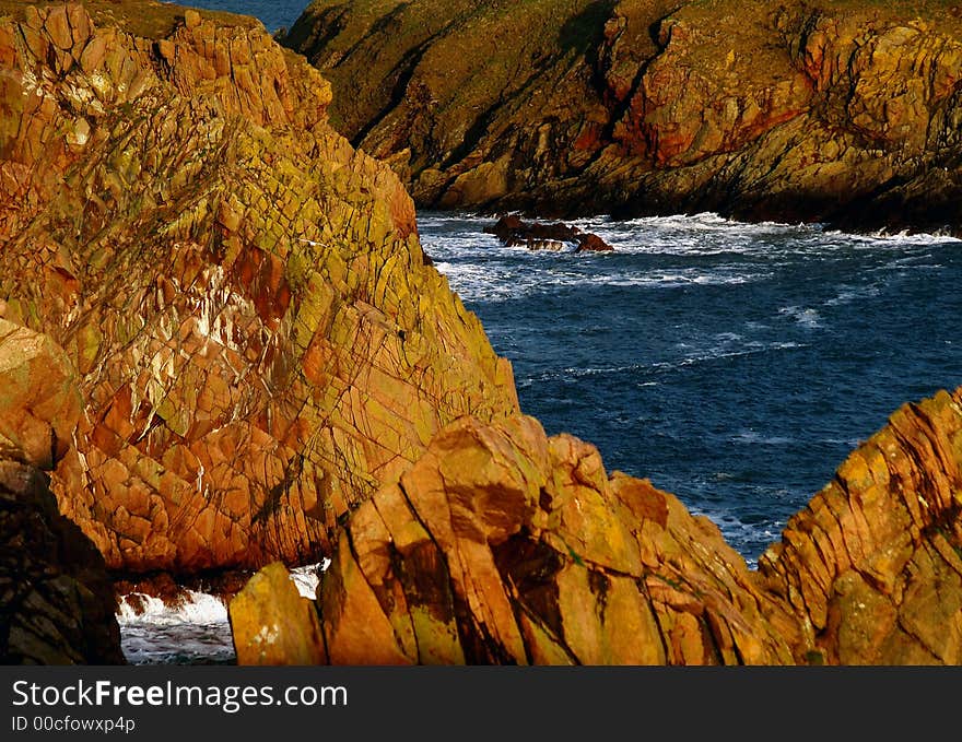 North sea and  multicolored cliff. North sea and  multicolored cliff