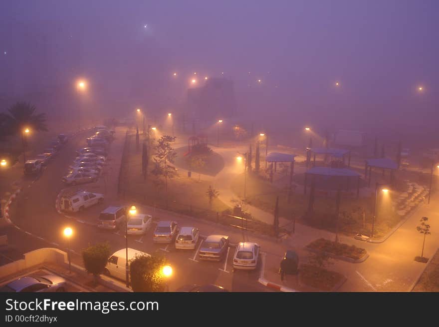 Foggy morning in the yard of big house (Holon, Israel)