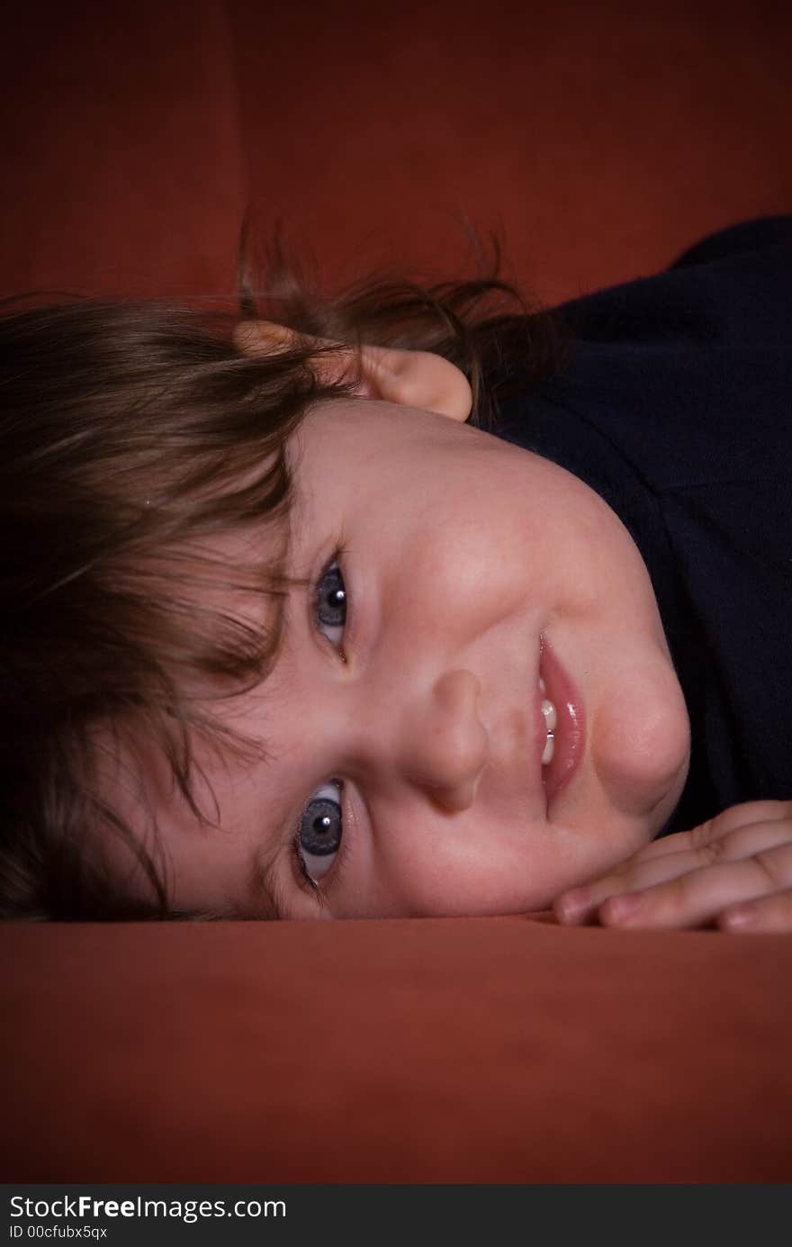 Small child on red background