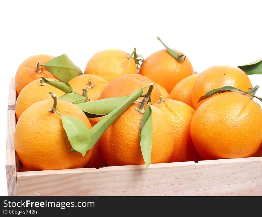 Oranges on old wooden box in a fruitshop