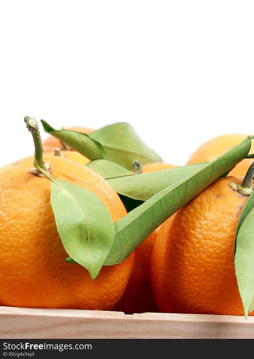 Oranges on old wooden box in a fruitshop