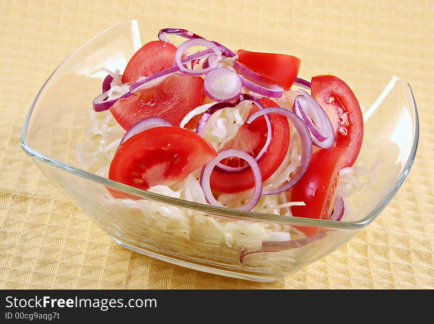 Salad from fresh cabbage, tomatoes and onions-vitamin diet