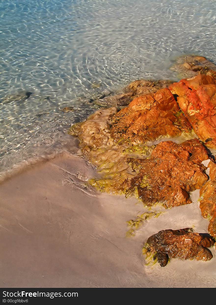 The crystal-clear water in a beach in Italy (Sardinia)