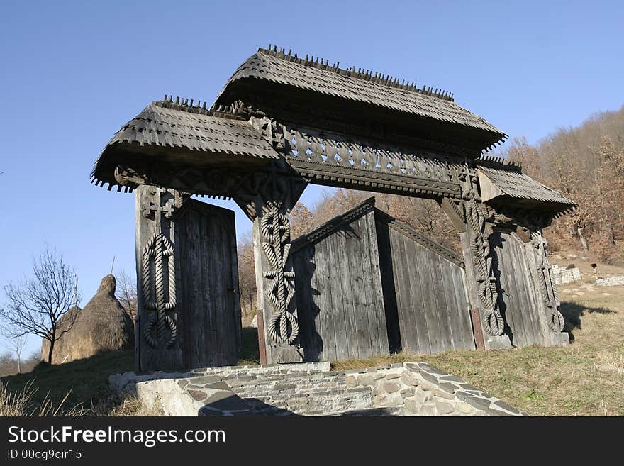 Wooden gate carved with traditional models