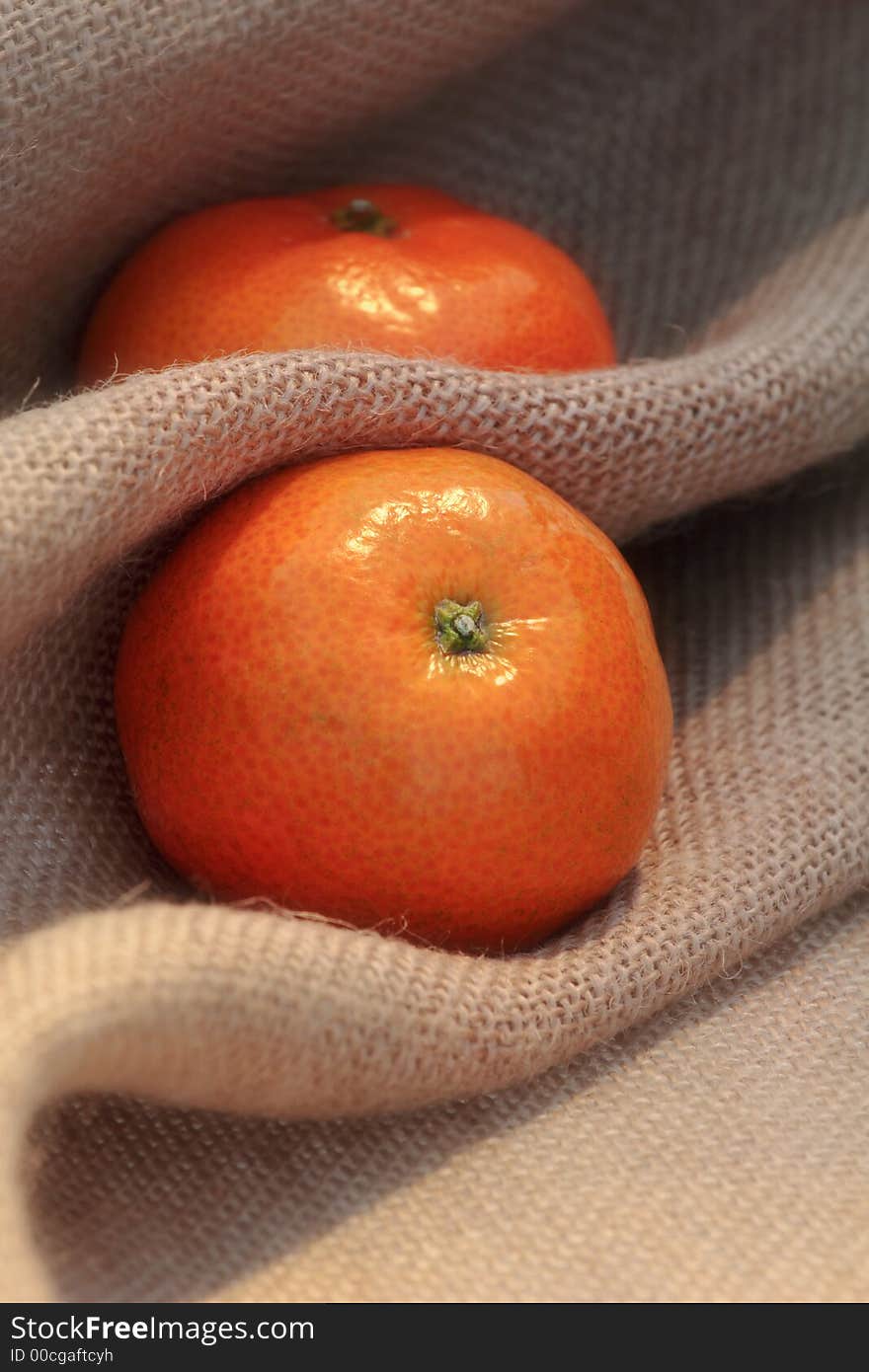 Juicy fresh clementines on hessian sack