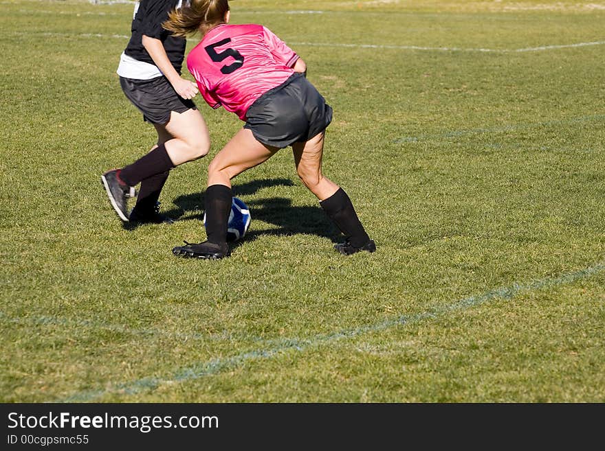 A challenging forward is stopped in her an attempt to make a goal. A challenging forward is stopped in her an attempt to make a goal.