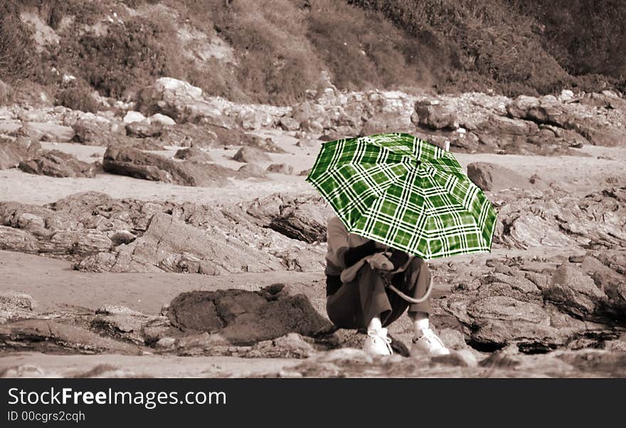 A women hiding under the umbrella