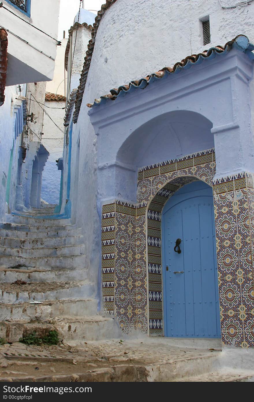 Doorway with Islamic tiled surround in Chefchouan, Morocco, North Africa. Doorway with Islamic tiled surround in Chefchouan, Morocco, North Africa