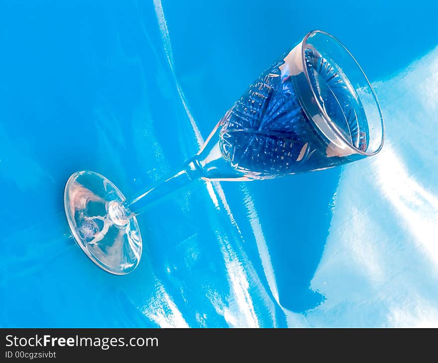 Tall glass with blue drink on white background. Tall glass with blue drink on white background