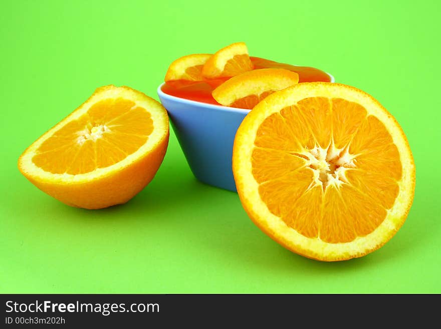 Orange Jelly in a white bowl with silverware. Orange Jelly in a white bowl with silverware.