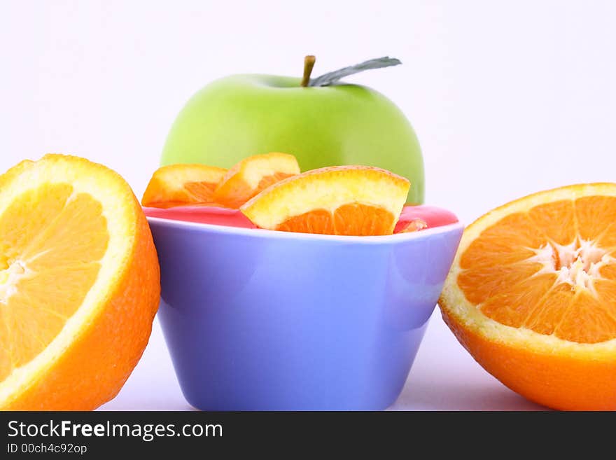 Orange Jelly in a white bowl with silverware. Orange Jelly in a white bowl with silverware.