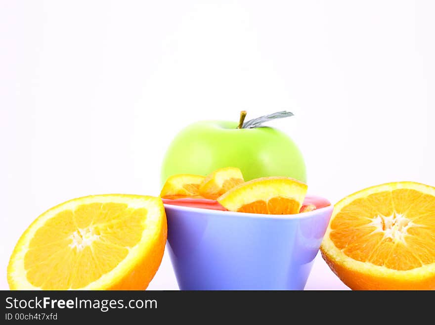 Orange Jelly in a white bowl with silverware. Orange Jelly in a white bowl with silverware.