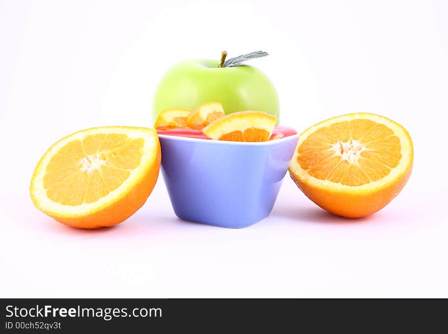 Orange Jelly in a white bowl with silverware. Orange Jelly in a white bowl with silverware.