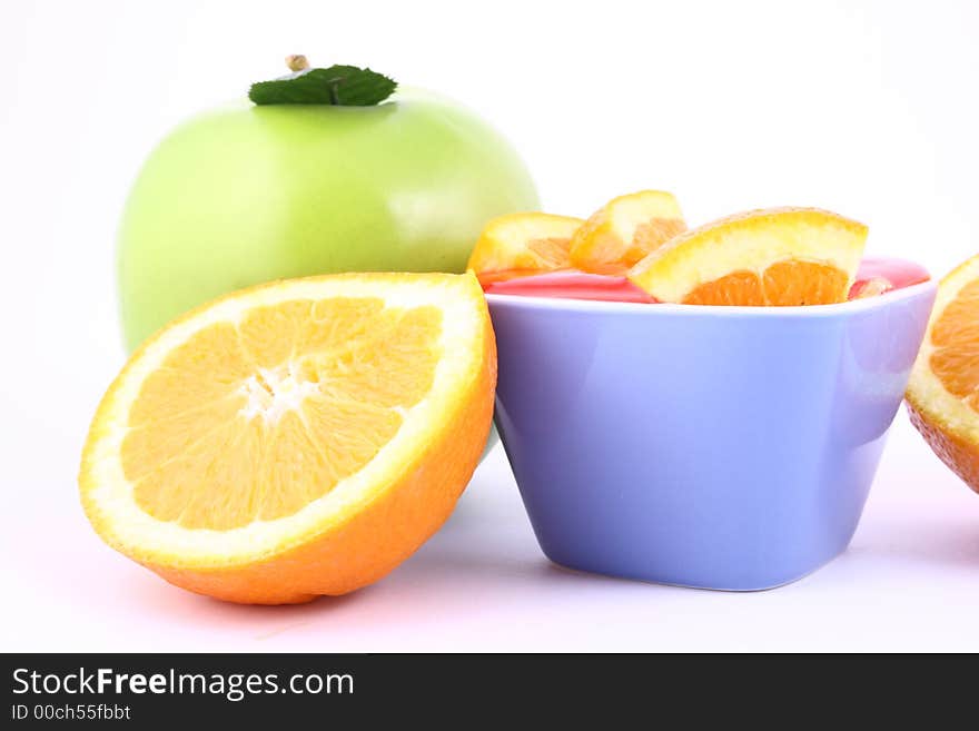 Orange Jelly in a white bowl with silverware. Orange Jelly in a white bowl with silverware.