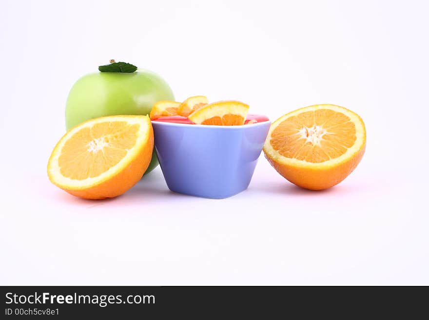 Orange Jelly in a white bowl with silverware. Orange Jelly in a white bowl with silverware.