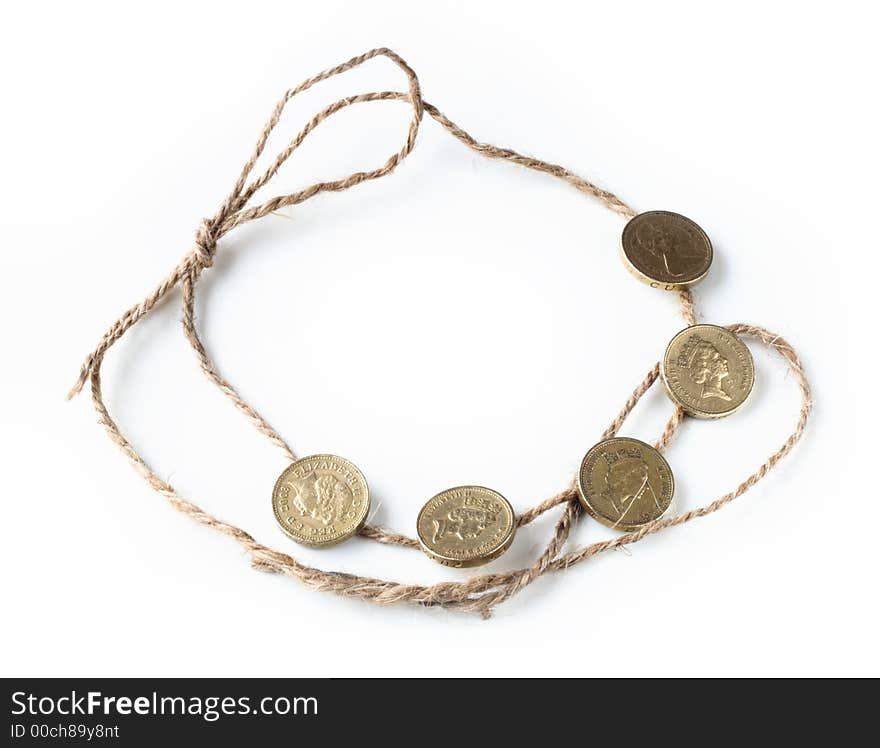 Five One Pound British Coins On The Rope