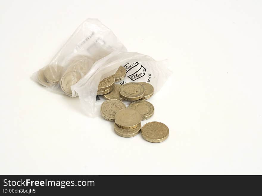 Twenty pounds per pound from coin bag on white background. Twenty pounds per pound from coin bag on white background