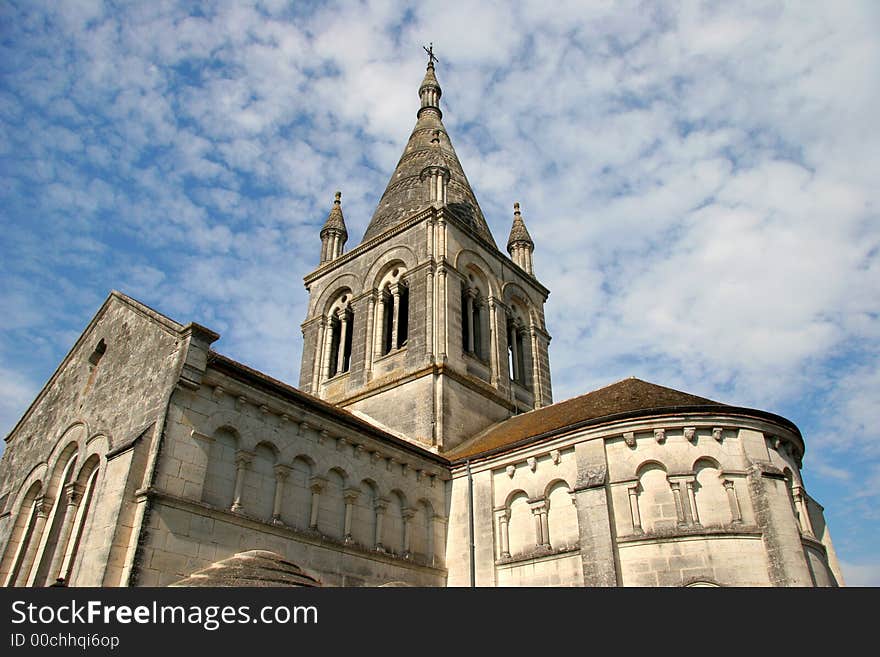 Historic church in France against a mackerel sky