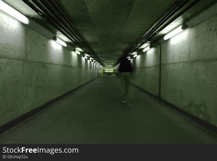 A ghostly figure walking down a dark hallway