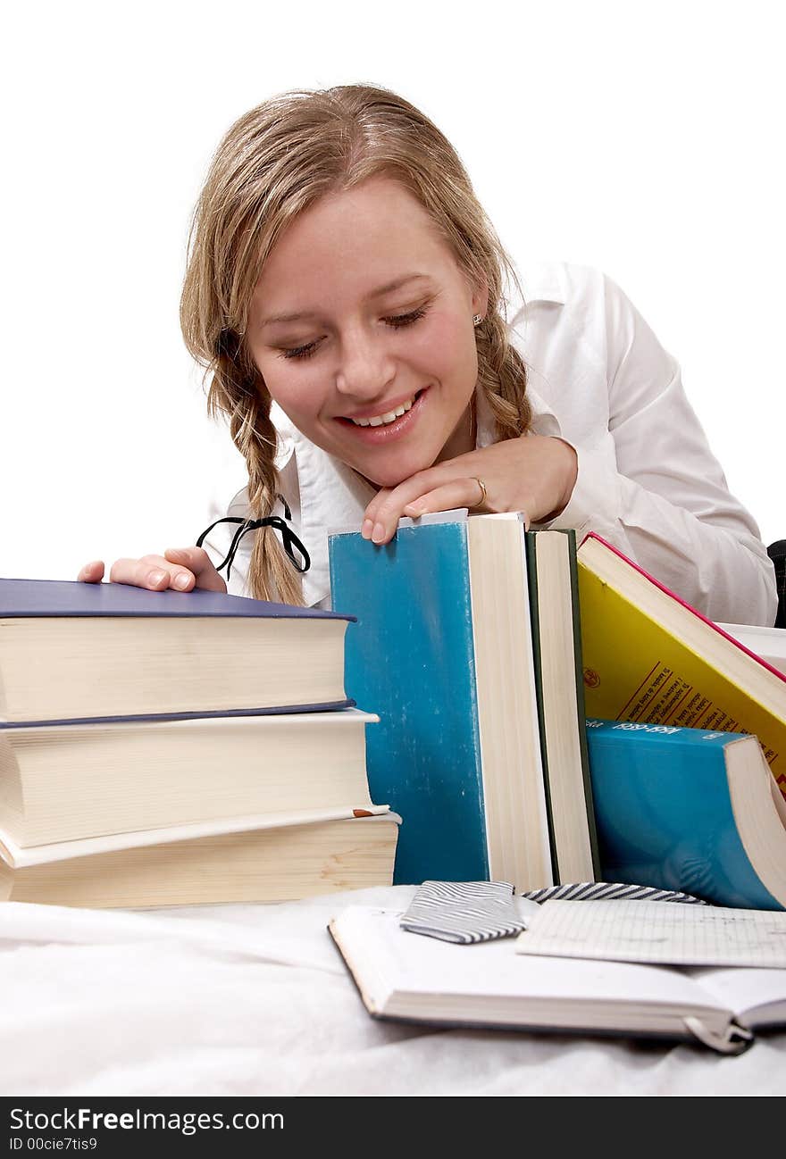 Schoolgirl or student looking at books, separate on white