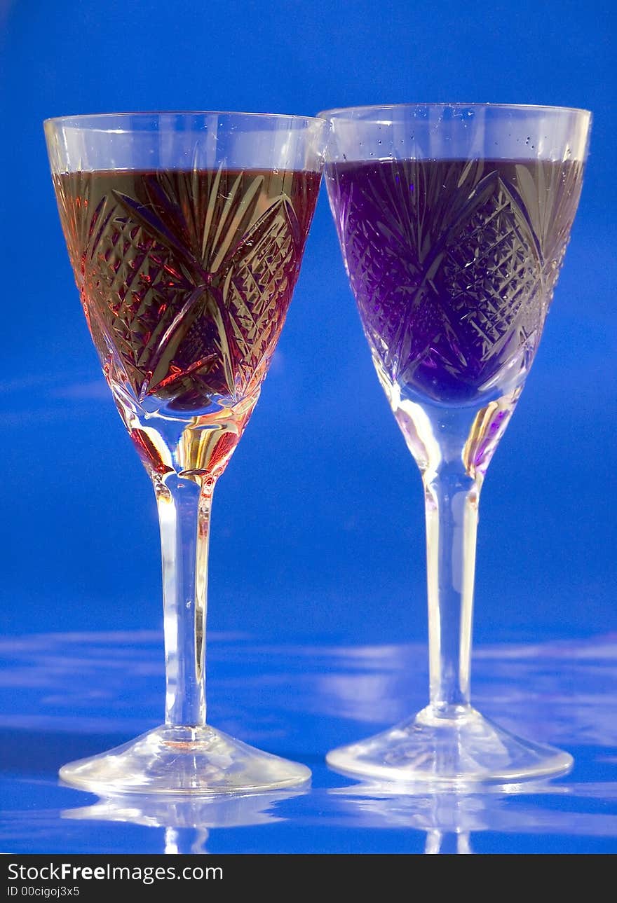 Tall glass with blue drink on white background. Tall glass with blue drink on white background