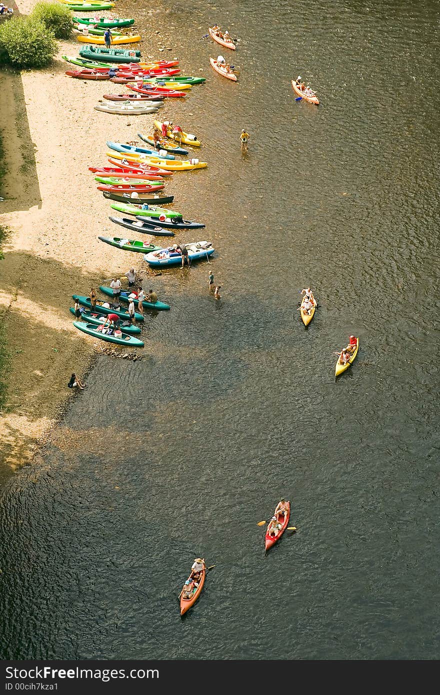 Colourful canoe and waterman on river