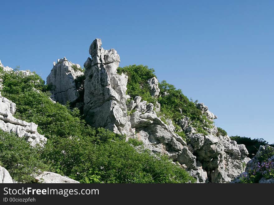 Rock, grass and sky at summer