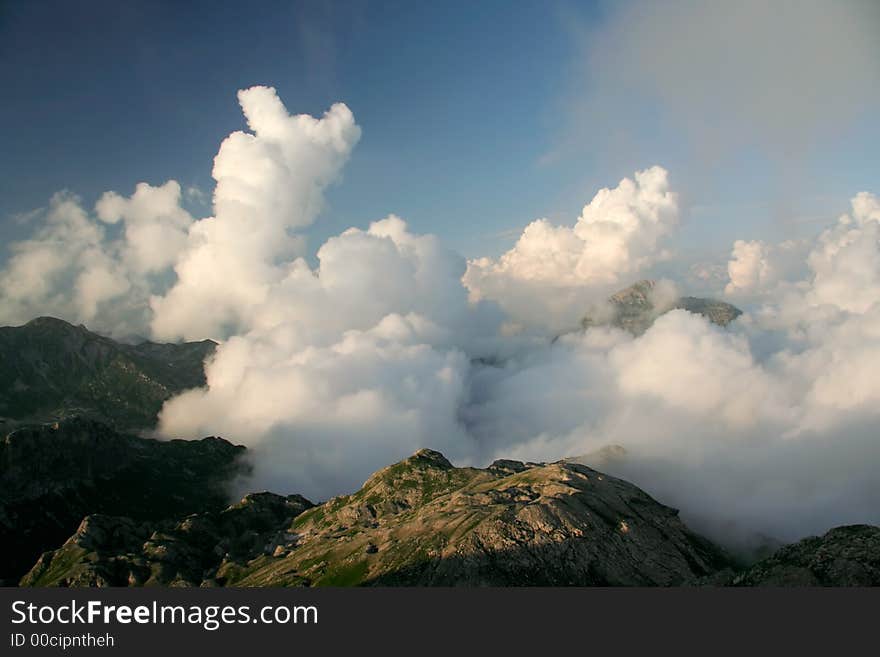 Clouds under mountains