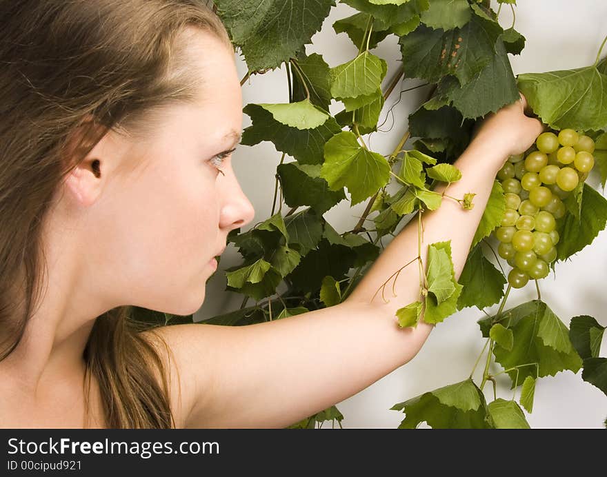 Beautiful young woman portrait with green grape. Beautiful young woman portrait with green grape