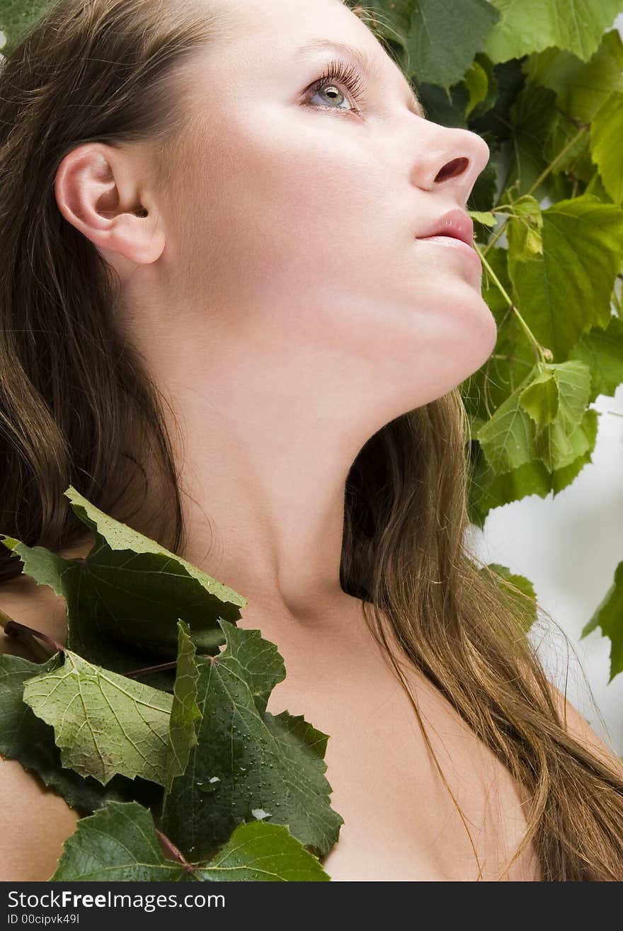 Beautiful young woman portrait with green grape. Beautiful young woman portrait with green grape