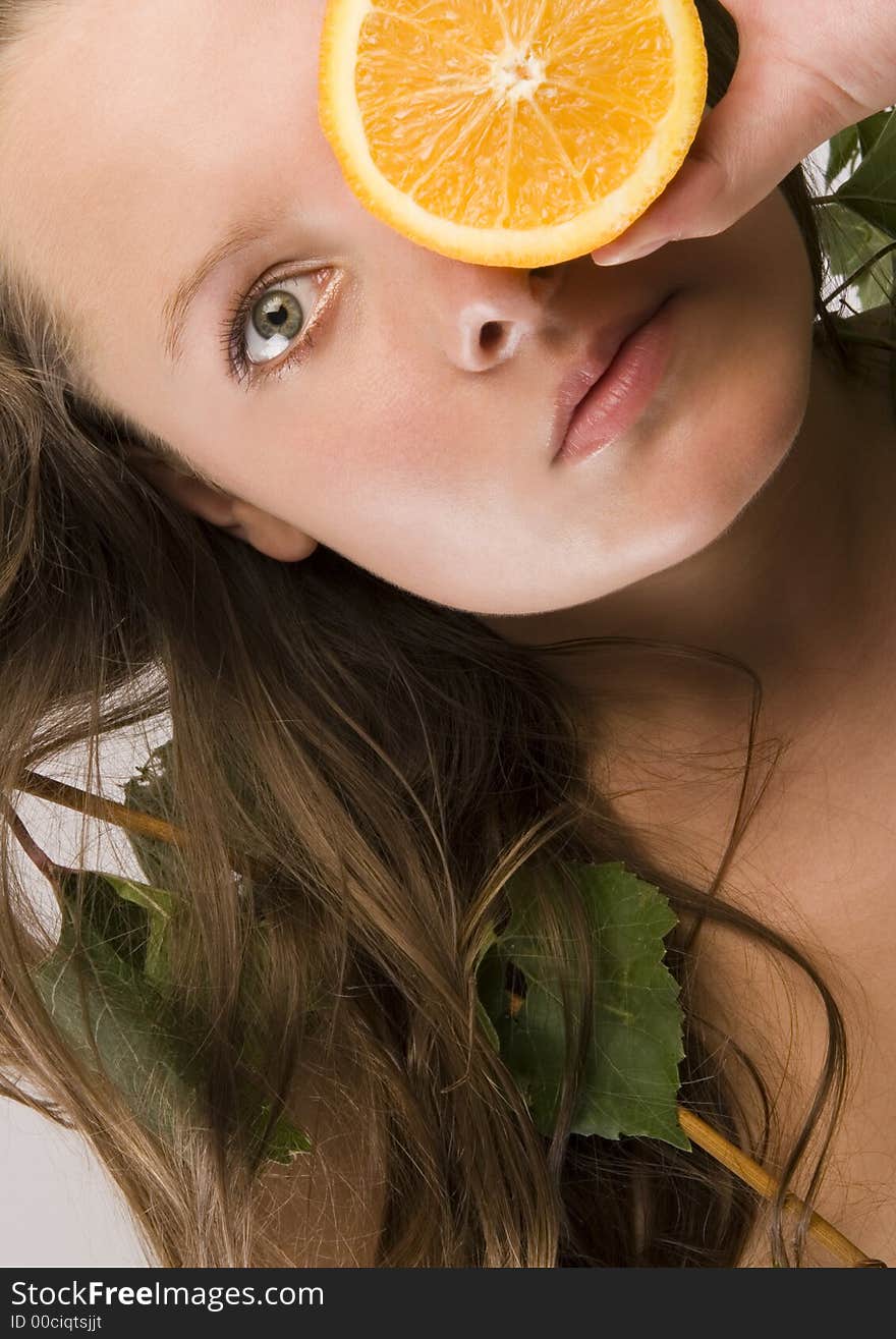 Beautiful young woman portrait with orange. Beautiful young woman portrait with orange