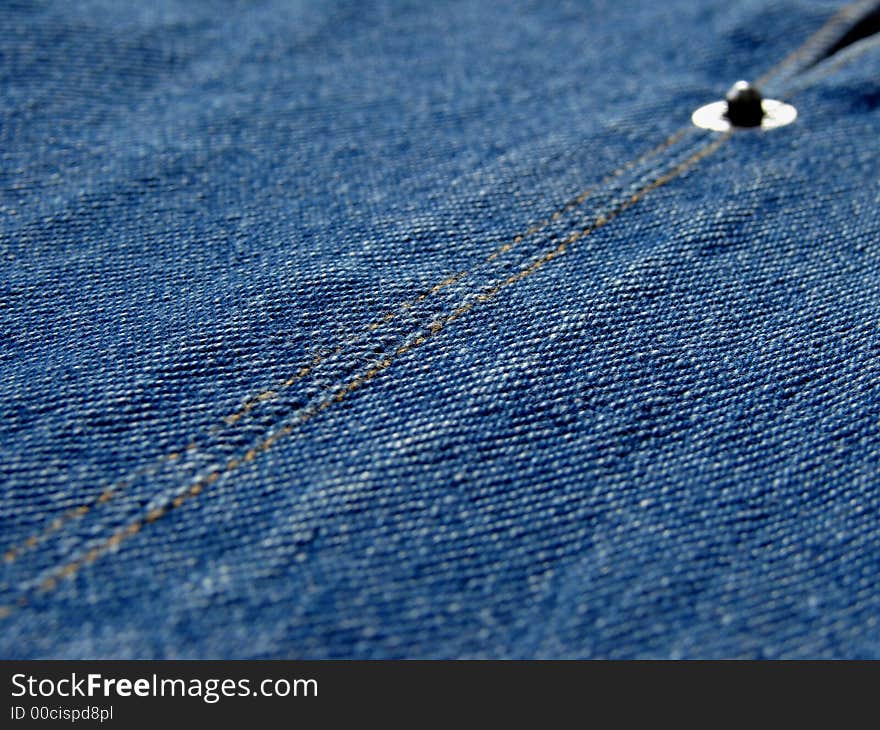 Denim clothes fragment with a thimble. Denim clothes fragment with a thimble