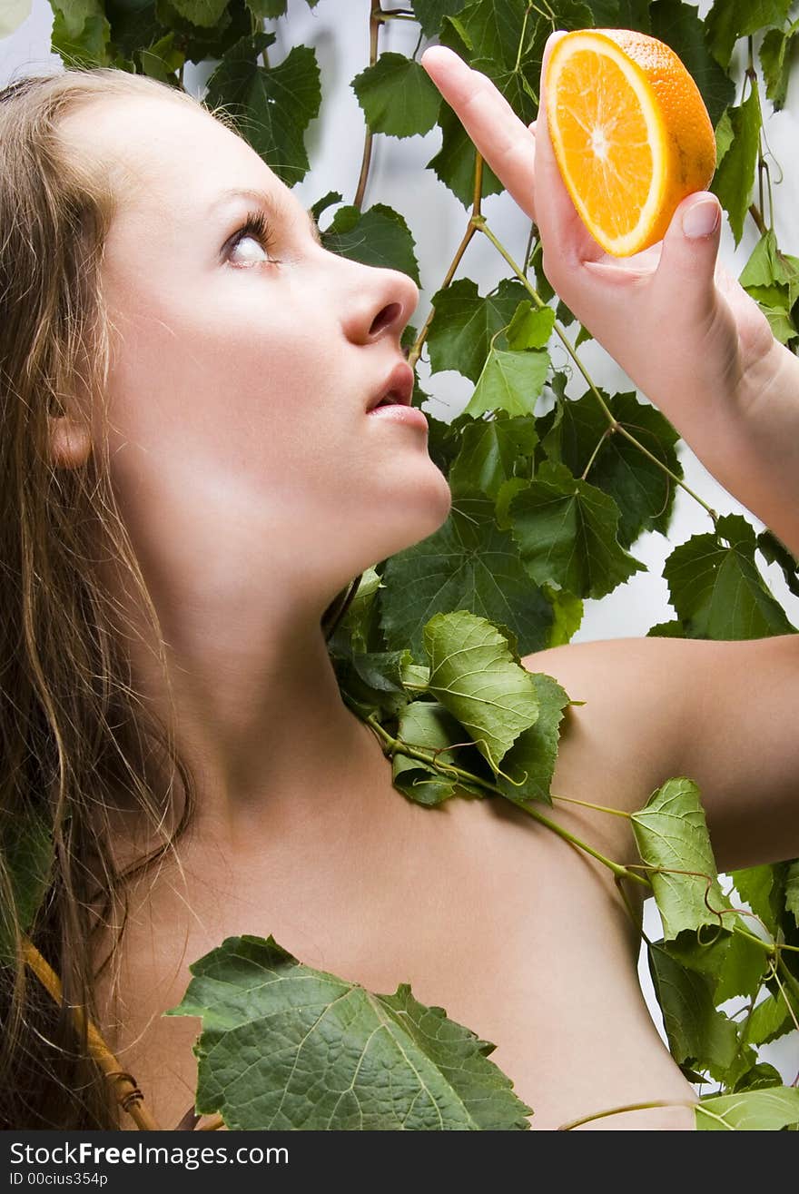 Beautiful young woman portrait with orange. Beautiful young woman portrait with orange