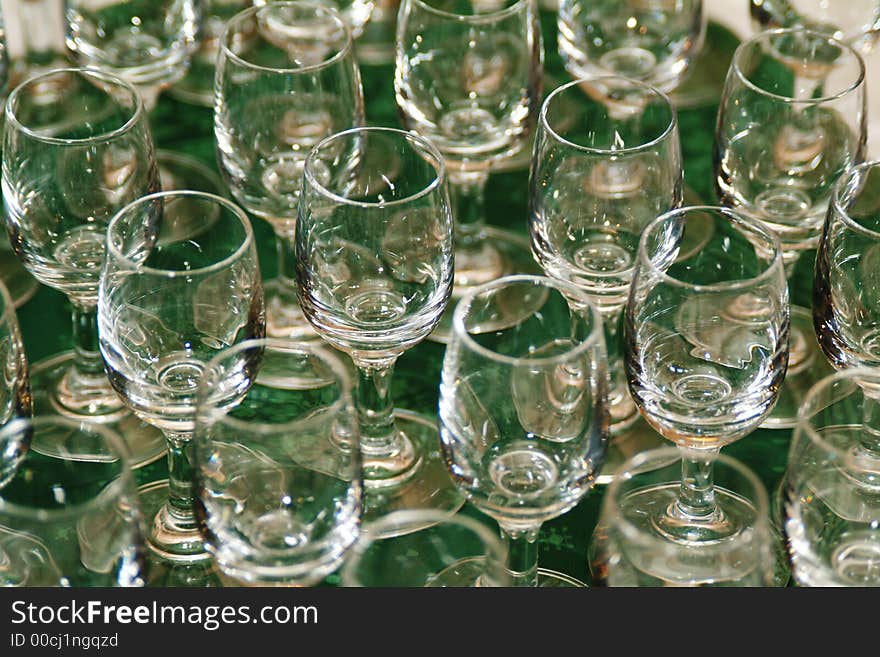 Wine glasses on green table