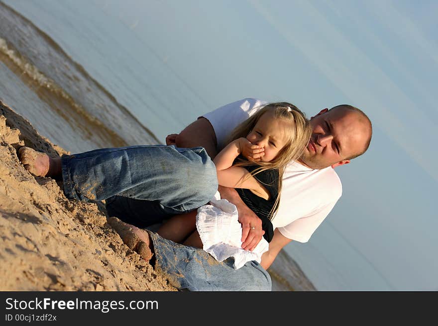 Father and daughter on a beach