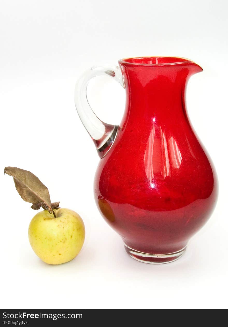 Green apple and red jug. Green apple and red jug