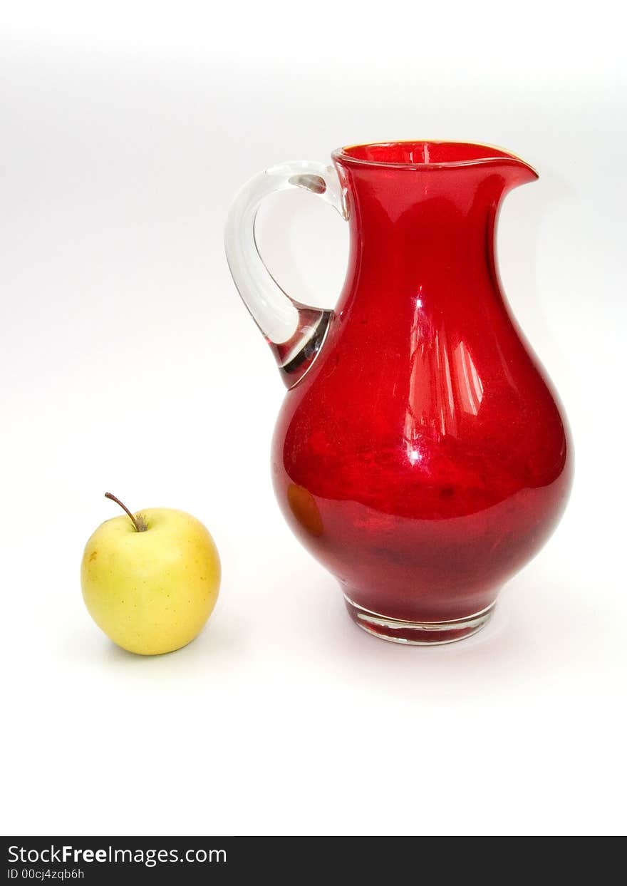 Green apple with red jug. Green apple with red jug