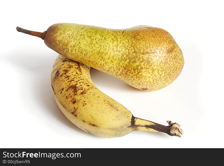 Fruits on the white background (banana and pear)