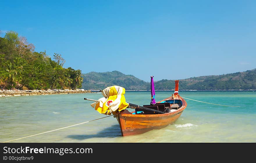 Lonely boat  is waiting for it’s biggest cruise in the shallow water