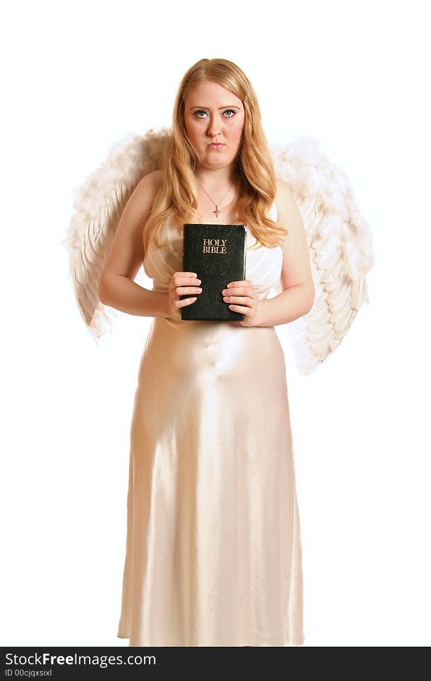 Isolated goddess angel with wing holding a bible. Isolated goddess angel with wing holding a bible