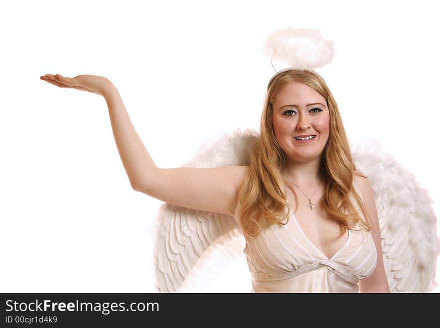 Isolated goddess angel with wing smiling and holding up her hand. with copyspace on her hand. Isolated goddess angel with wing smiling and holding up her hand. with copyspace on her hand