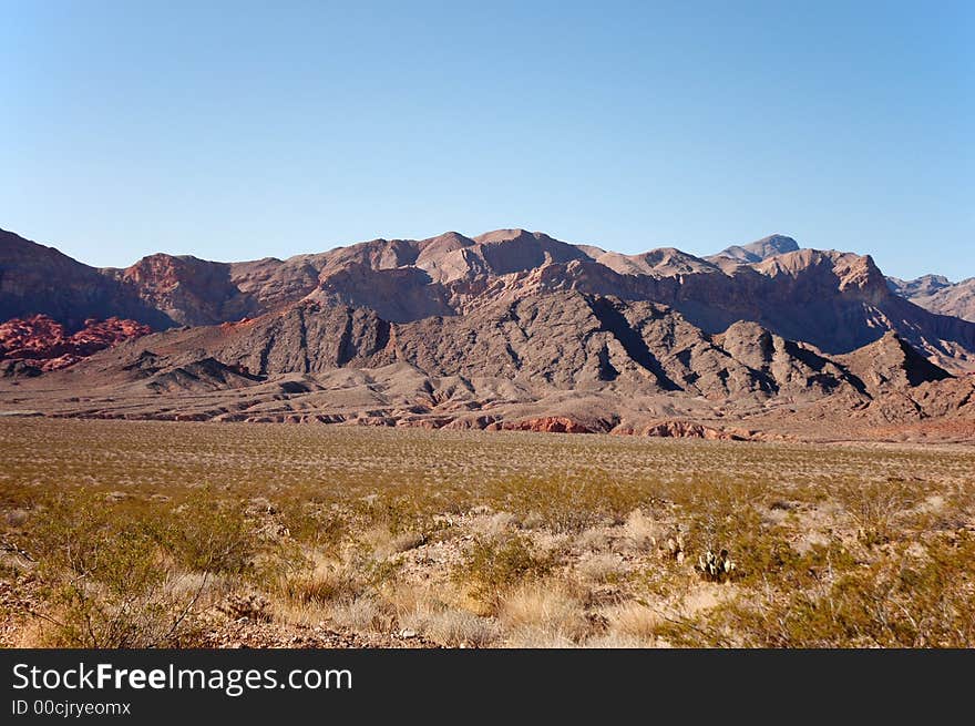 Desert landscape with mountains and blue sky