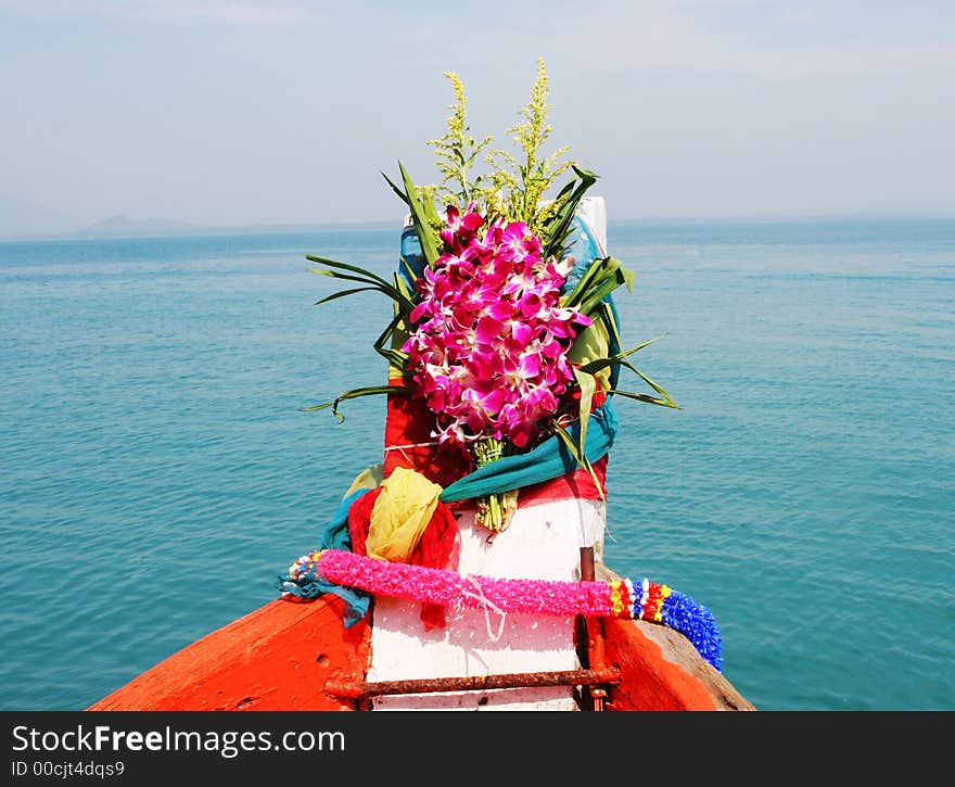 It is Thai tradition to put flowers on a boat for a safe journey - travel and tourism. It is Thai tradition to put flowers on a boat for a safe journey - travel and tourism