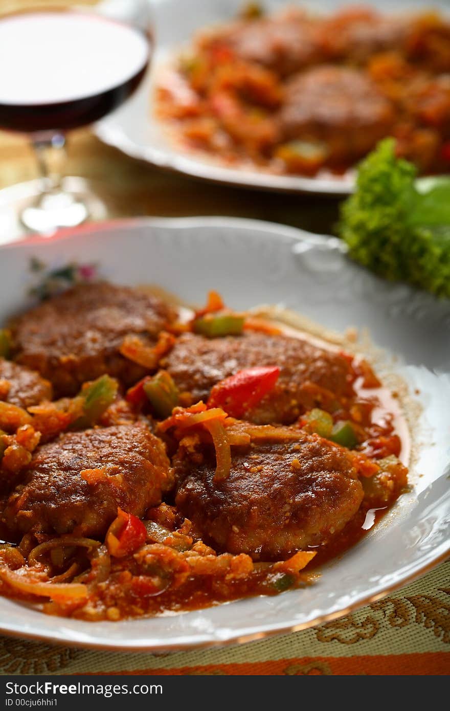 Oven mutton with vegetables served with red wine