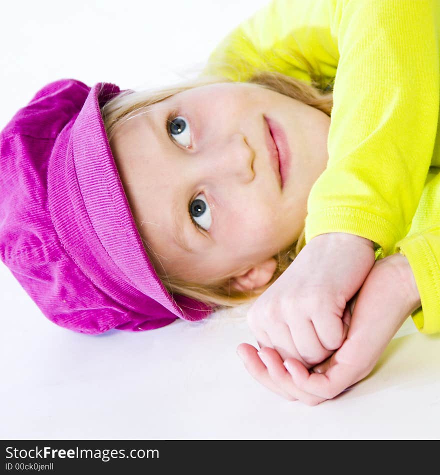 A model portrait in the studio, laying. A model portrait in the studio, laying