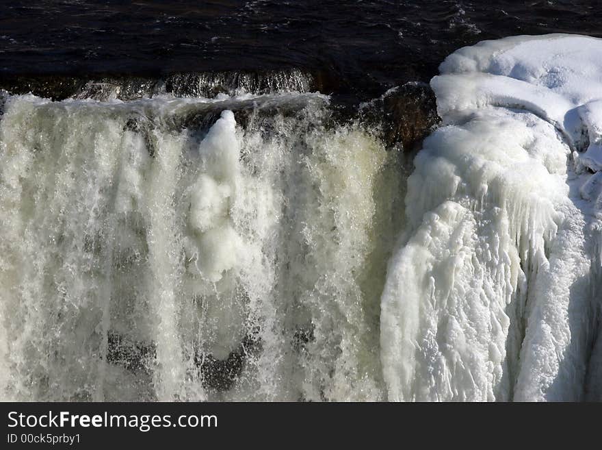 Winter waterfall with ice and snow