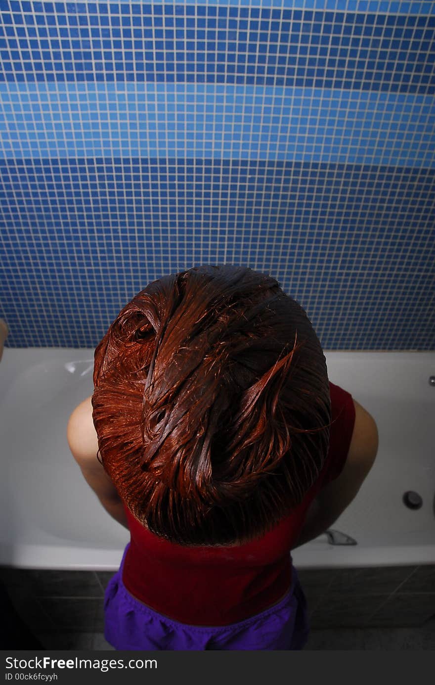 Girl with dyeing in the bathroom. Girl with dyeing in the bathroom