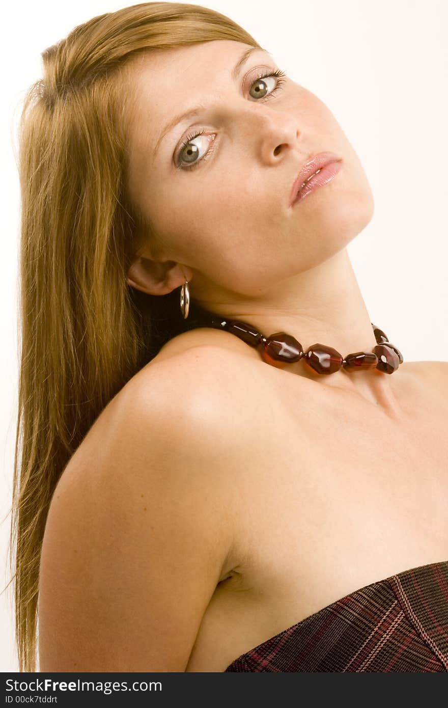 A young woman against a plain background.