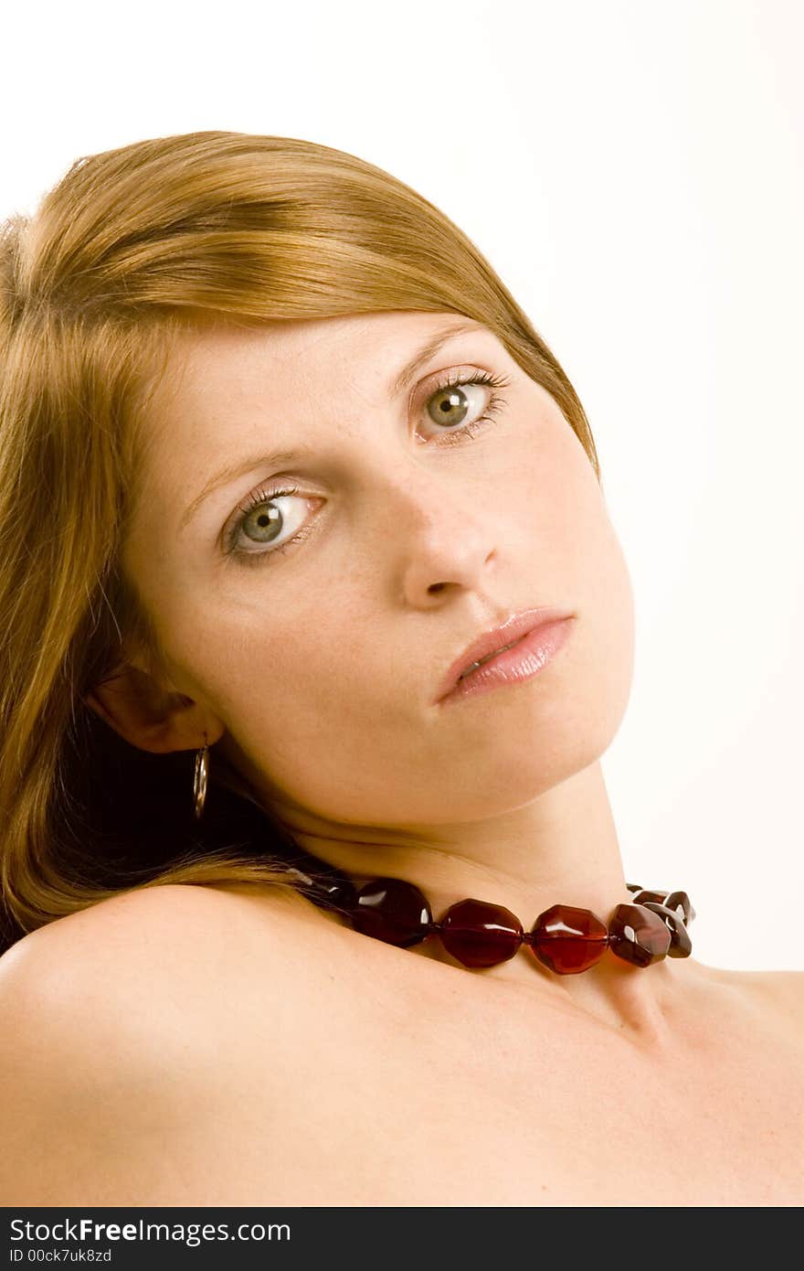 A young woman against a plain background.