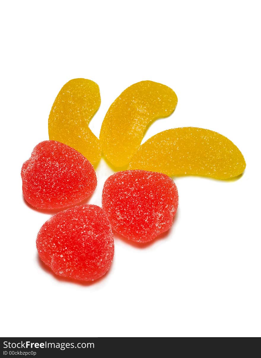 Close-up red and yellow sweets isolated on white. Close-up red and yellow sweets isolated on white.